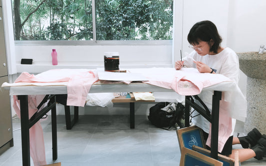 Melody working hard on the Leave UV collection while stationed in the toilet